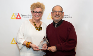 Lifetime Arts co-founders posing with ATA Award