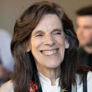 A photo of a woman smiling.