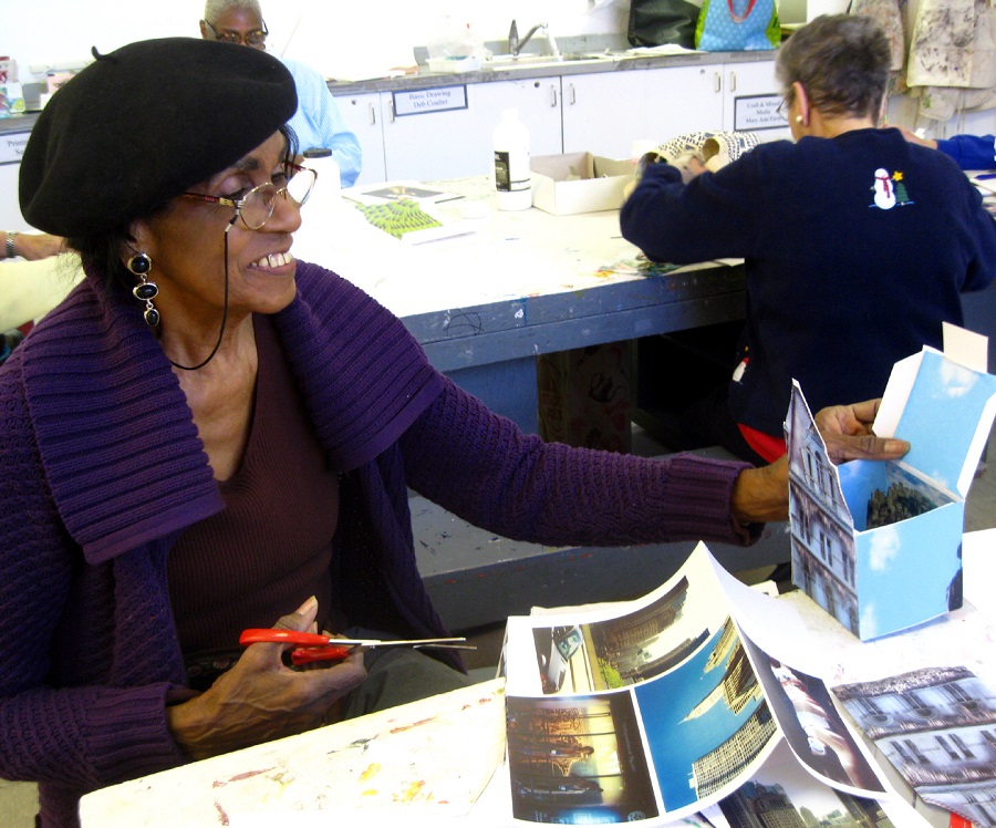 An African American older adult working on an art project. 