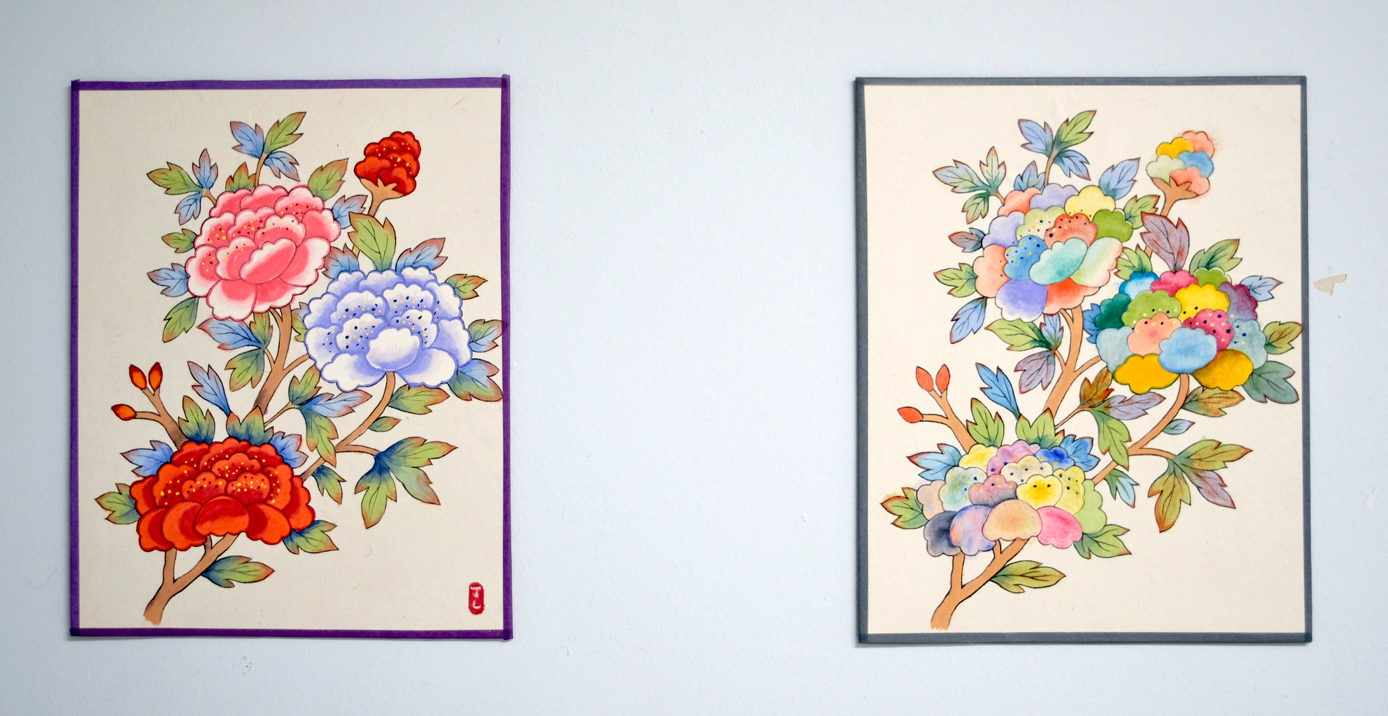 Two colorful, floral artworks.